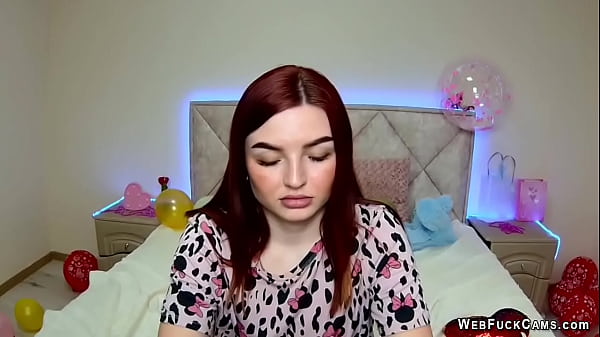 Redhead amateur babe strips pajamas and shows tattoo on webcam